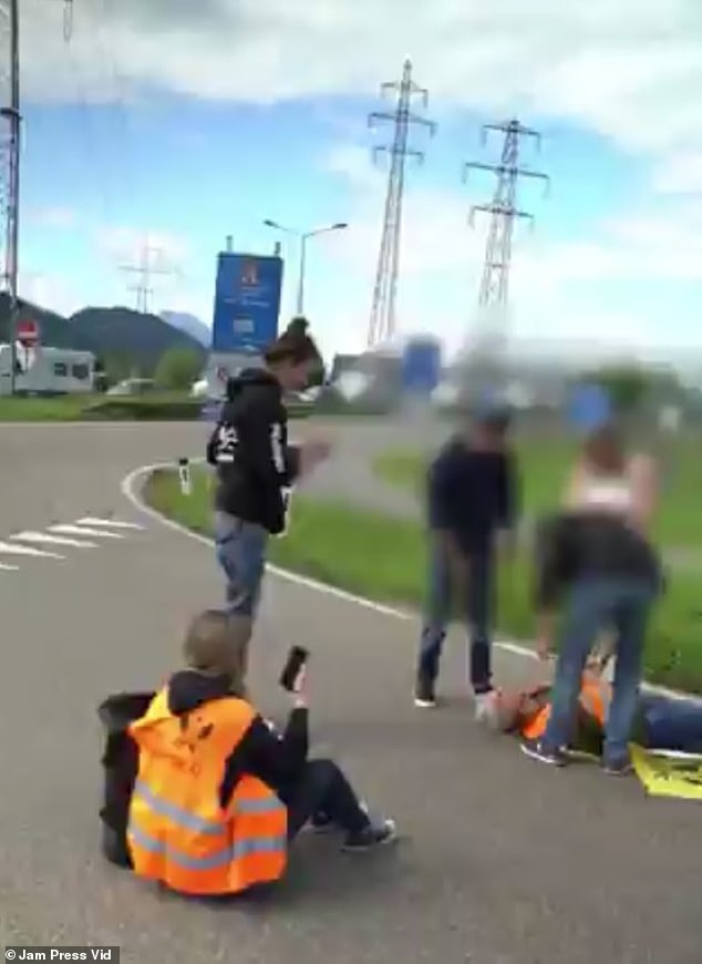 Members of Extinction Rebellion and the Last Generation taped themselves to a roundabout in Hohenems, close to the border with Switzerland