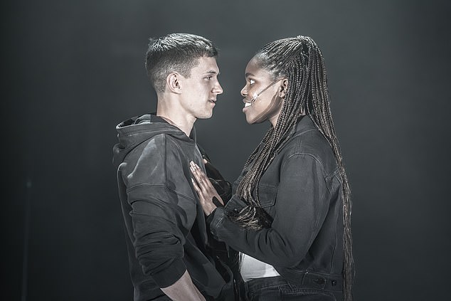 But ultimately Jamie Lloyd's daringly mournful production, which premiered in the West End last night, only requires him to reach the dizzying heights of a microphone stand.  Pictured: Tom Holland and Francesca Amewudah-Rivers as Romeo and Juliet