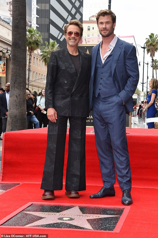 Chris' Marvel buddy Robert Downey Jr.  was dressed to impress in a chic black suit