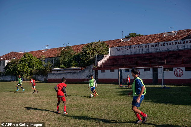 Children play football on the island of Paqueta, the little piece of sleepy paradise from which the player takes his name