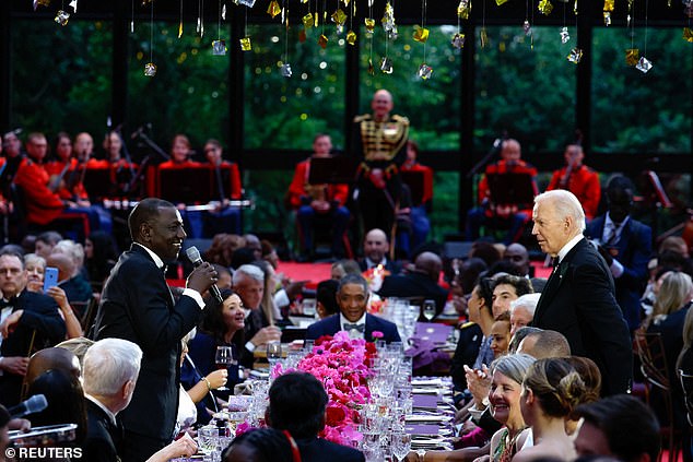 Kenyan President William Ruto and President Biden toast at the head table