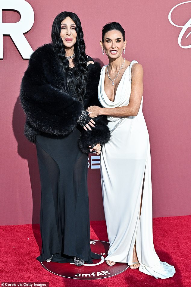 Earlier on the red carpet, Demi and Cher posed together in contrasting dresses, with Demi wearing white and Cher opting for a black outfit