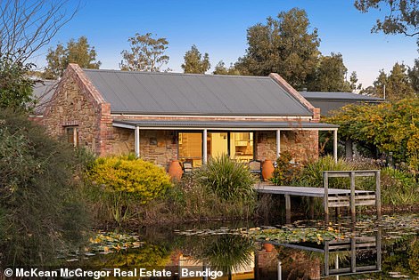 Inside is a small studio with open kitchen, living and dining room that opens onto a covered veranda that connects to the small jetty above the pond