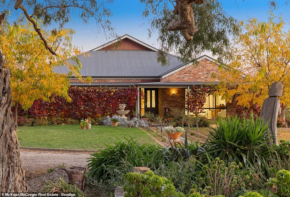 The main house is made from recycled bricks and has four bedrooms, two bathrooms, a master suite with an ensuite bathroom and walk-in closet and a contrasting modern kitchen