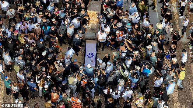 A drone shot shows mourners during the funeral of German-Israeli Shani Louk, who was killed in the October 7 attack by Palestinian Islamist group Hamas, in Srigim, Israel, May 19, 2024