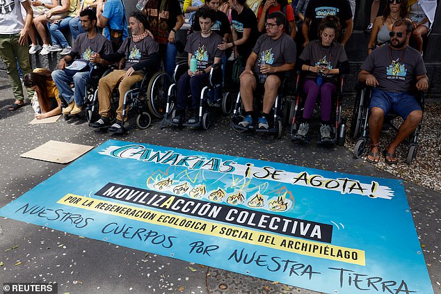 People on hunger strike sit in wheelchairs during a protest against a change in the tourism model in the Canary Islands, in Santa Cruz de Tenerife, Spain, last month