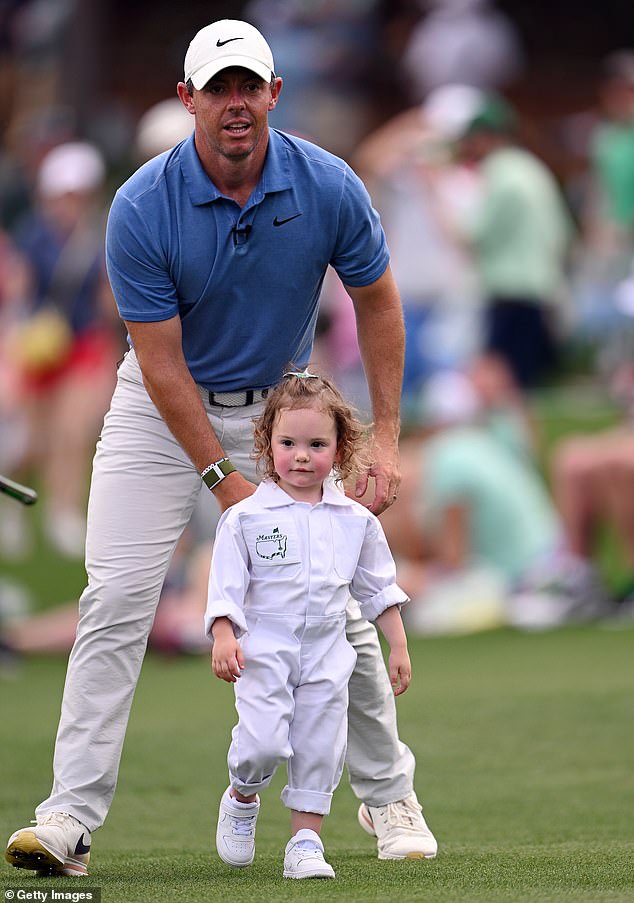 McIlroy is pictured with his daughter Poppy McIlroy at the 2023 Masters Par 3 competition