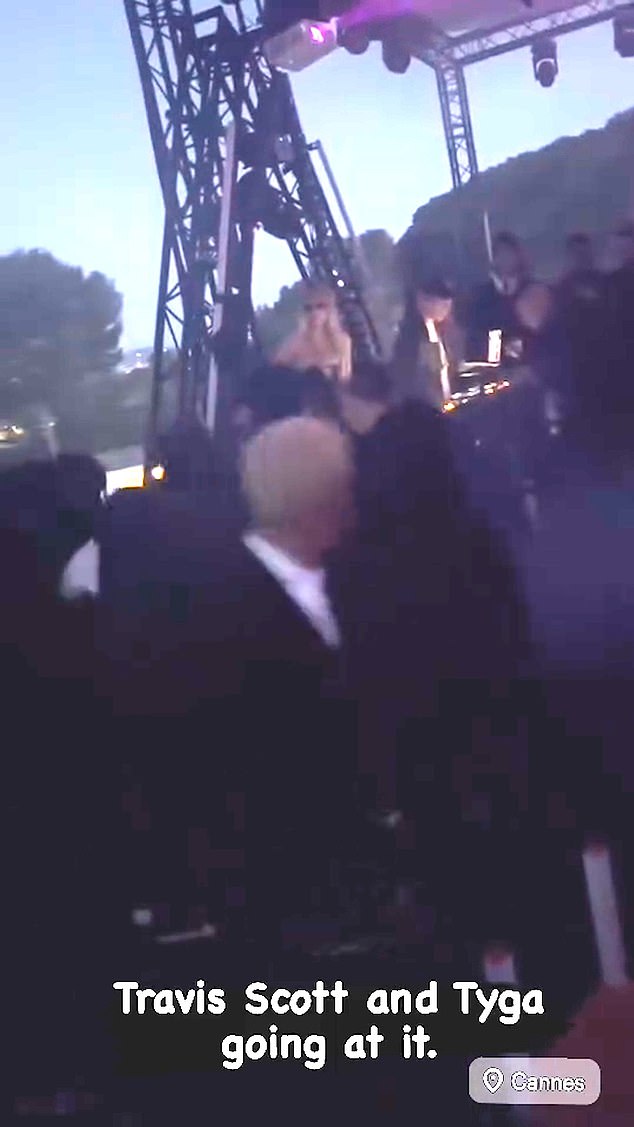 Travis reportedly took the microphone from Akiva, prompting Edwards (pictured front center), who was chatting with Tyga earlier in the evening, to say something to him.