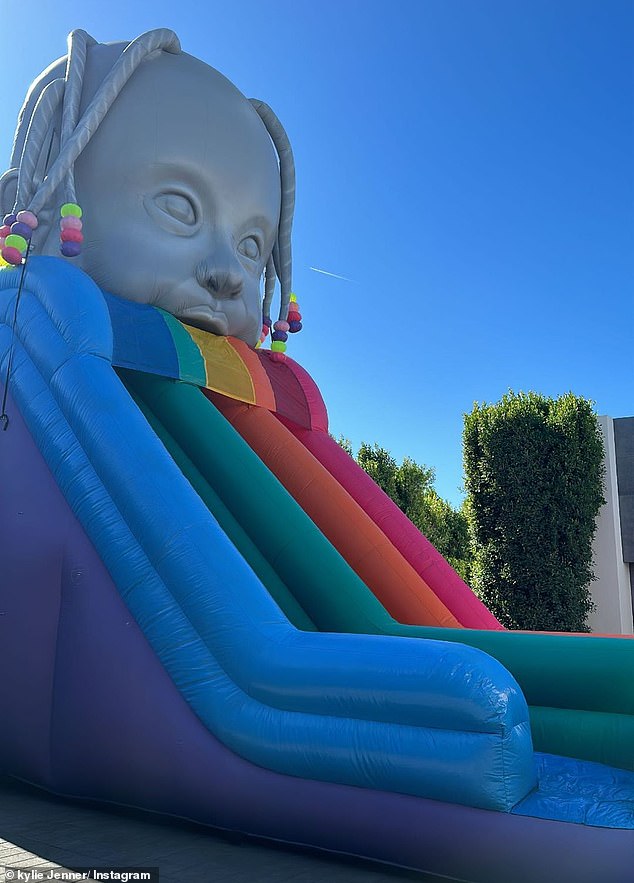 The party also included a giant inflatable rainbow slide from Astroworld for the children to enjoy