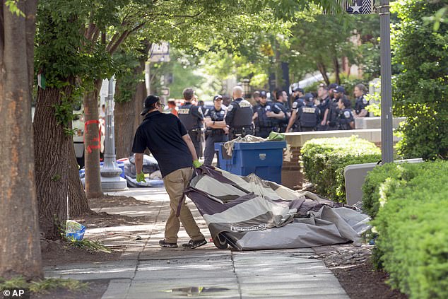 After the GW camp was cleared, workers removed tents, trash and leftover debris