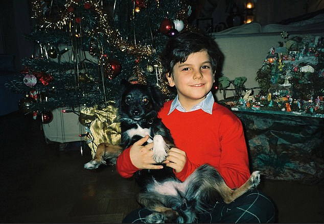 Carlo also helped the homeless and stood up for bullied classmates at school.  In the photo: young Carlo with his dog at Christmas