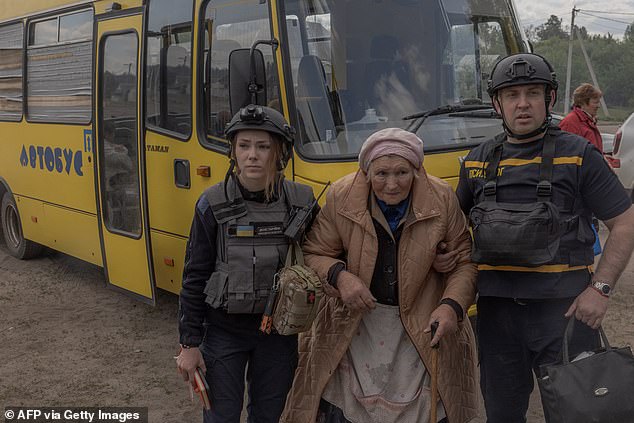 A Ukrainian evacuee arrives at an evacuation point in the Kharkov region on May 12, 2024