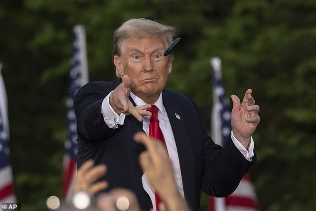 Former President Donald Trump throws a pen during his Thursday night rally in the Bronx.  During an interview after the rally, he declined to name his top three VP picks, which now reportedly includes Cotton