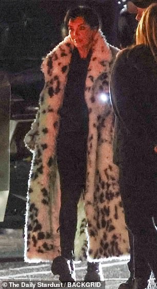 She stepped out in an ankle-length coat with animal print