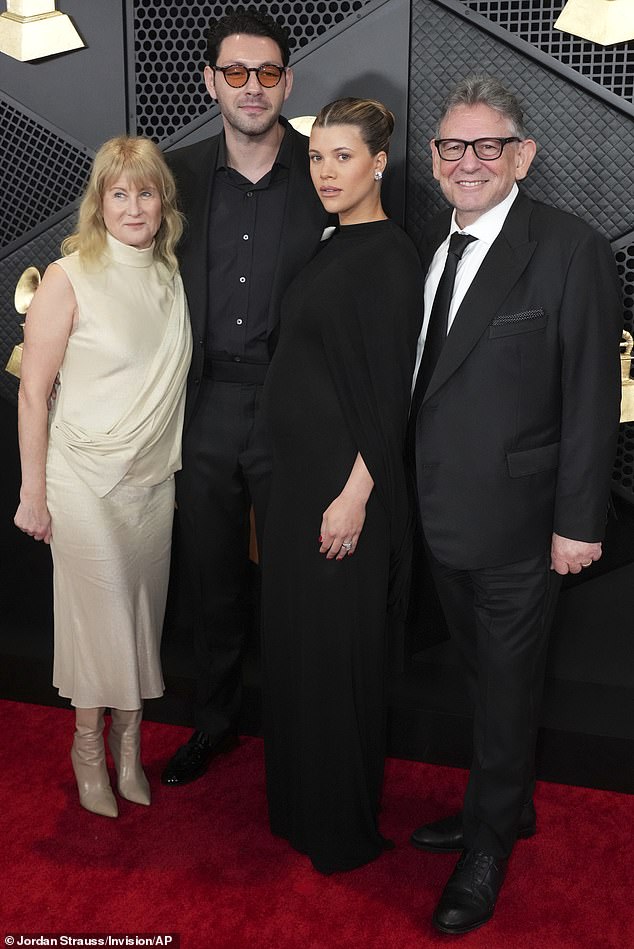 Sofia and Elliot are pictured at this year's Grammy Awards with his father, eminent music mogul Sir Lucian Grainge (right) and stepmother Caroline Grainge (left)