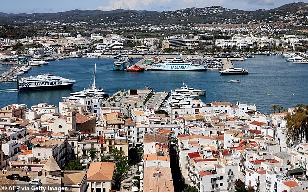 At the end of the protest, a letter was read out from an Ibiza-born woman who linked her decision to leave the island with her family and move to the Spanish mainland to a 'destructive' tourism model.  In the photo: the port and old town of Ibiza