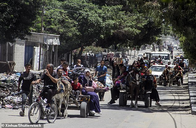 Palestinians fleeing from Jabalia in the northern region arrive in Gaza City on May 24, 2024