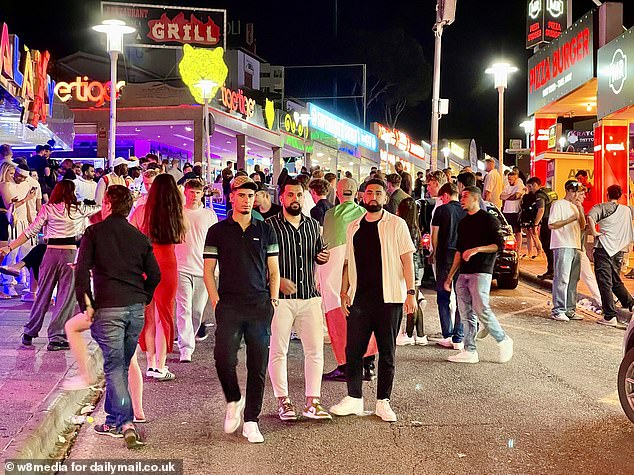 Tourists gather on the strip in Magaluf, Mallorca for a boozy night out