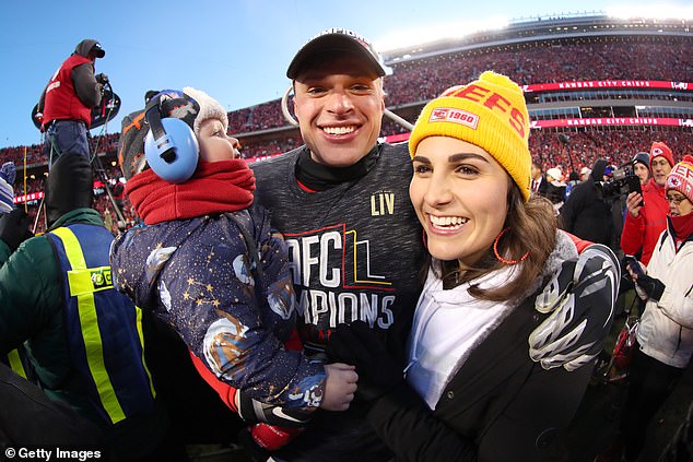 Butker celebrates on the field with his wife Isabelle and their son after beating the Tennessee Titans in the AFC Championship Game at Arrowhead Stadium on January 19, 2020