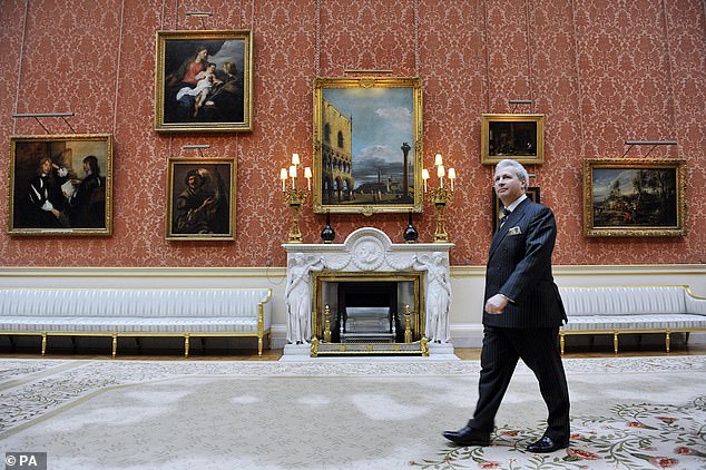 Edward Griffiths, then Deputy Master of the Household, walks through the Buckingham Palace photo gallery, 2011