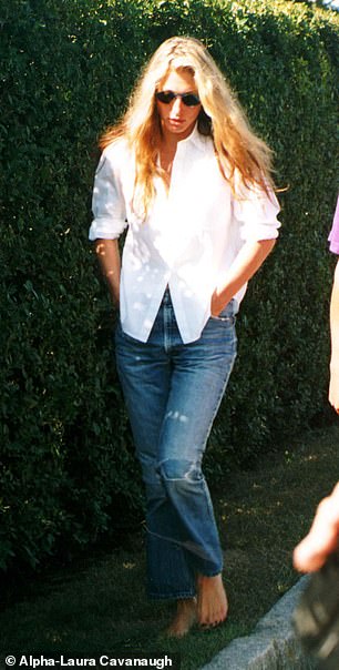 Carolyn dressed for Labor Day in 1996 in a similar oversized shirt with rolled up sleeves, ripped jeans, messy hair and sunglasses