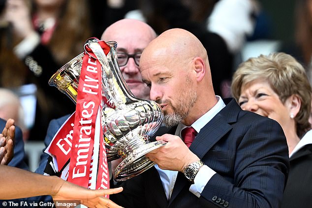 United manager Ten Hag kisses the FA Cup as his side completed their trophy victory at Wembley