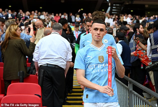 Phil Foden quickly removed his second medal as he walked back down the steps of Wembley