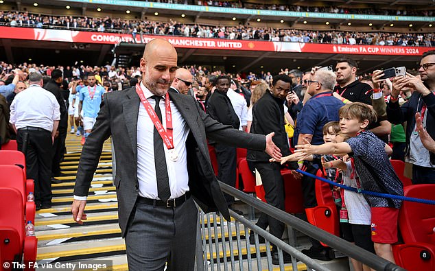 Guardiola claps hands with young supporters despite losing the final at the home of English football