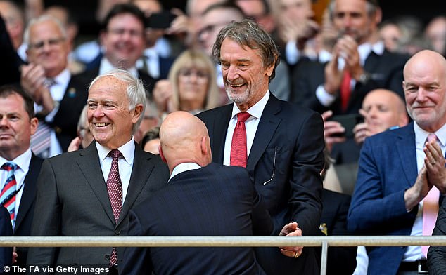 Ten Hag shakes hands with a delighted Man United investor and British billionaire Sir Jim Ratcliffe
