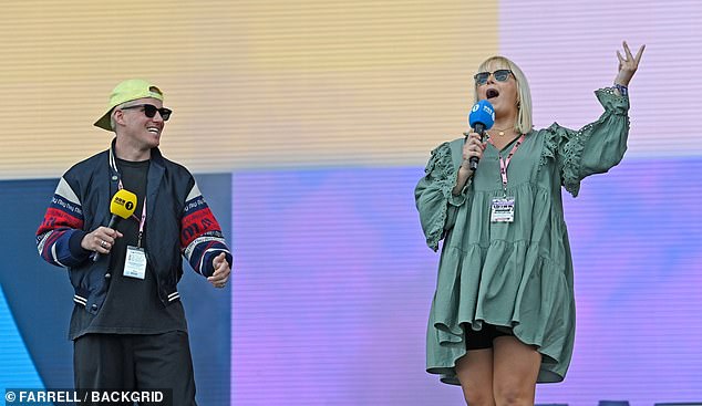 He was joined on stage by Katie Thistleton, who wore a green long-sleeved mini dress and black cycling shorts