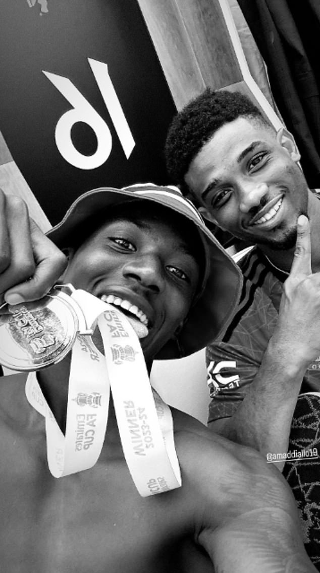 Amad Diallo and Kobbie Mainoo, who scored United's second goal, show off their medals
