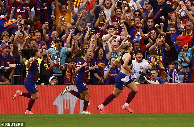 She drove off to celebrate with the Barcelona fans behind the goal after clinching the victory