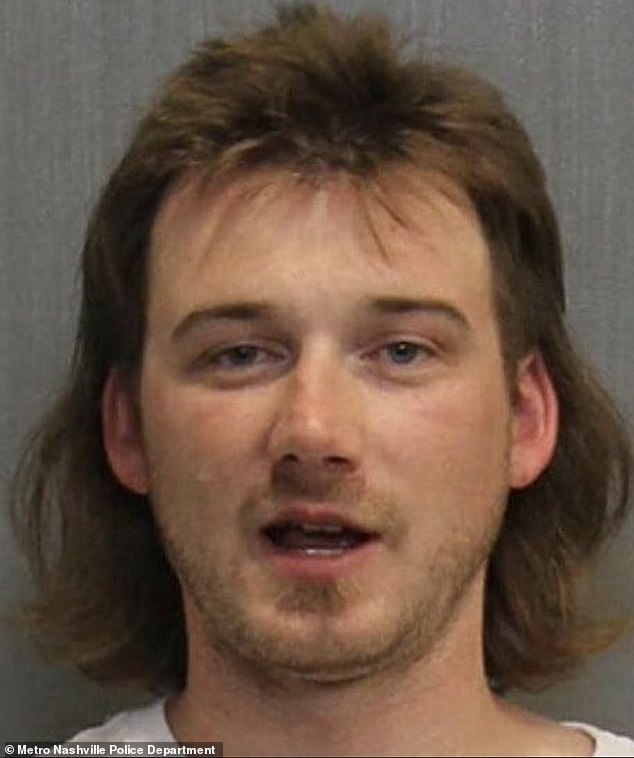 On Tuesday, the Nashville Metro Council denied Wallen's request due to his past controversies, including his arrest last month and past use of racial slurs (seen above in a 2020 mugshot taken after he was arrested for public intoxication at Kid Rock's club).  in Nashville)