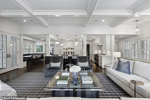 A family room and screened porch with fireplace create a retreat for relaxation