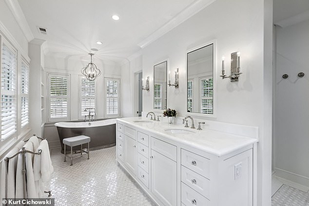 Pictured: The master suite's spa bathroom with tile floors is elegant and luxurious