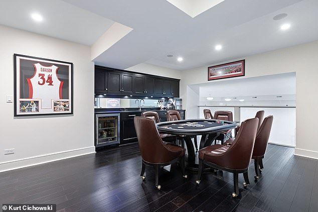 Pictured: The basement wet bar with Chicago sports memorabilia