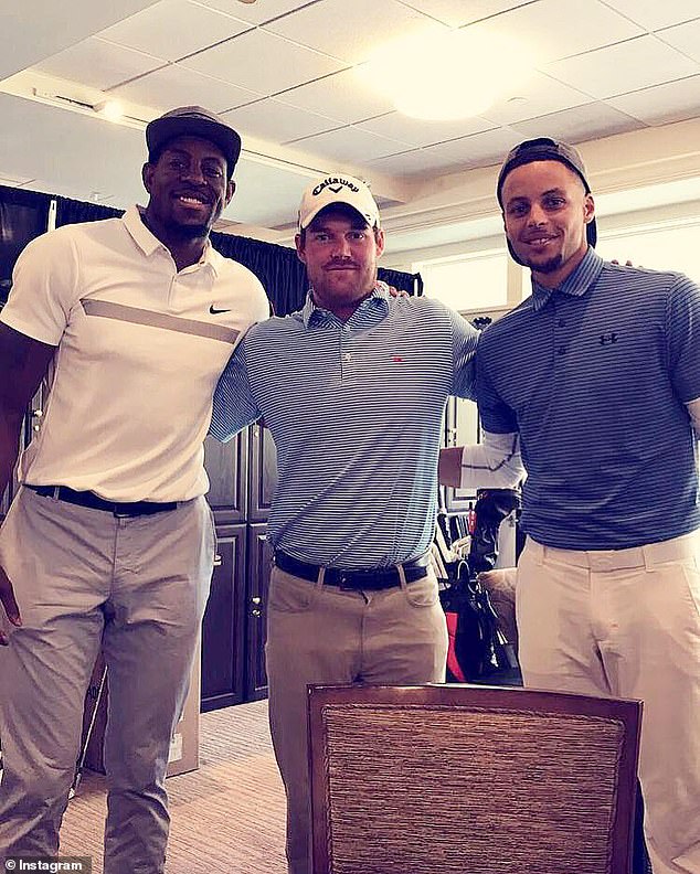 Murray flanked by NBA legends Andre Iguodala (left) and Stephen Curry (right)