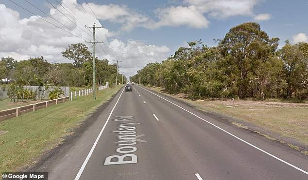 Queensland Police said the woman, in her 40s, was walking along Boundry Road (pictured) when she was struck and killed by a silver Ford Falcon.