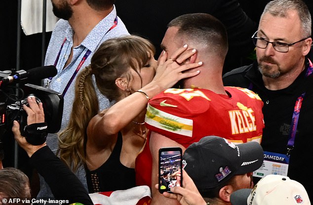 Her NFL star boyfriend Travis Kelce, 34, was set to join her in the country for a getaway (pictured kissing at the Super Bowl after Kansas City's win)