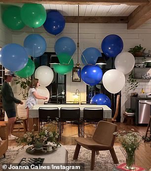 At the beginning of the video, Joanna filmed some of her children and herself lighting up blue, green and white balloons near the kitchen and living room of their home.