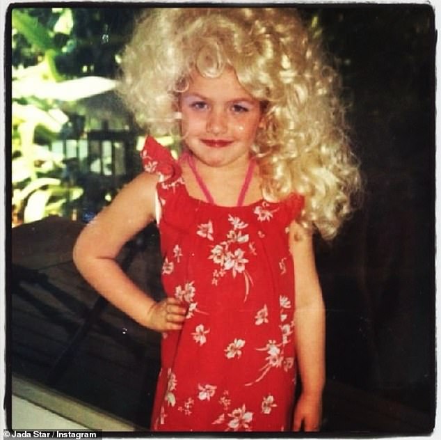 Instead, she raided her aunt's wardrobe and tried on her iconic blonde wigs (pictured)