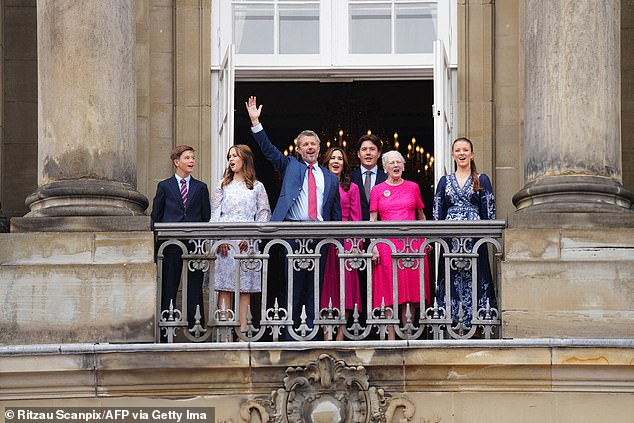 Pictured: King Frederik seen waving to the crowd of royal fans in Copenhagen wishing him a happy 56th birthday