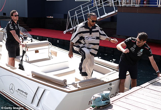 Lewis was seen getting off a Mercedes boat as he arrived at the paddock
