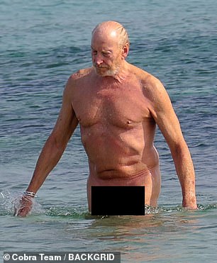 Charles showed off his toned physique as he strolled along the sands of the nudist beach before taking a cool dip in the ocean