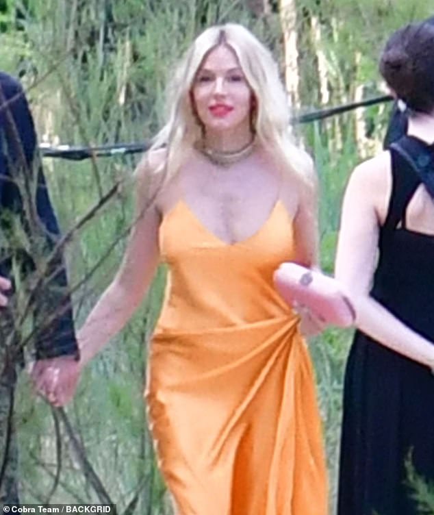 Sienna wore her flowing skirt as she made her way to the ceremony