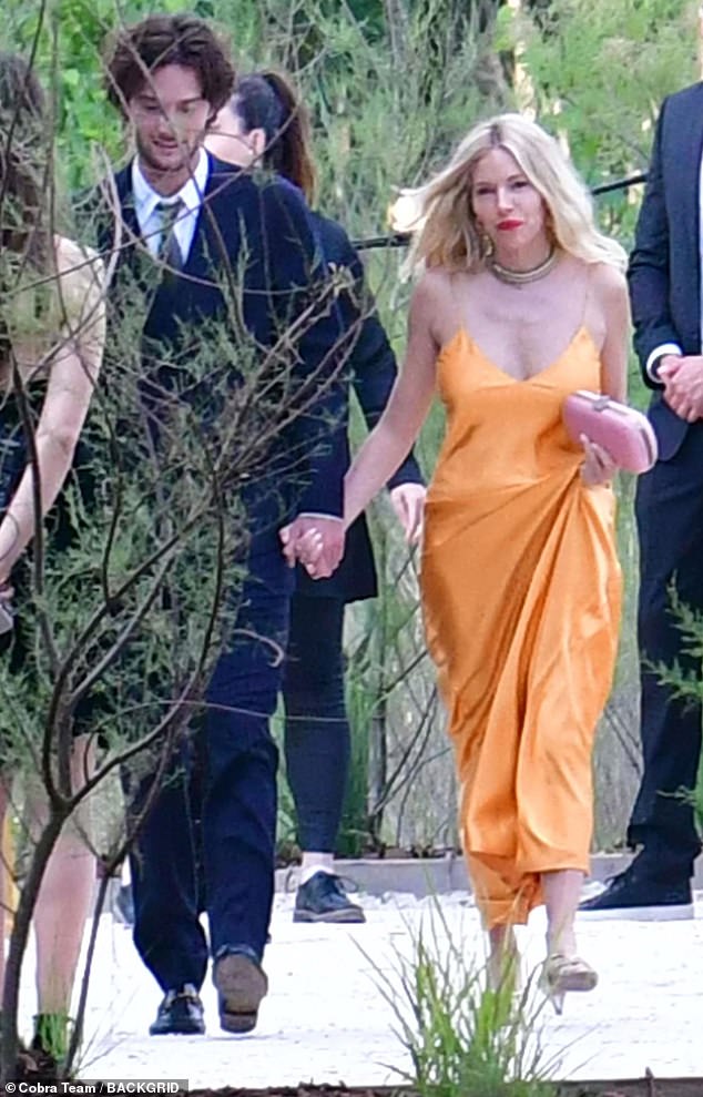 Sienna and Oli were spotted strolling together in the sunshine after the ceremony