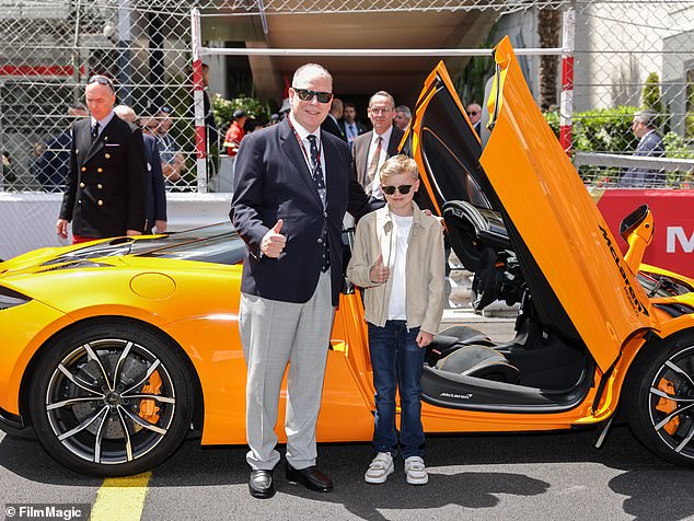 Prince Albert poses with son Prince Jacques during the Monaco Grand Prix in Monte Carlo this afternoon