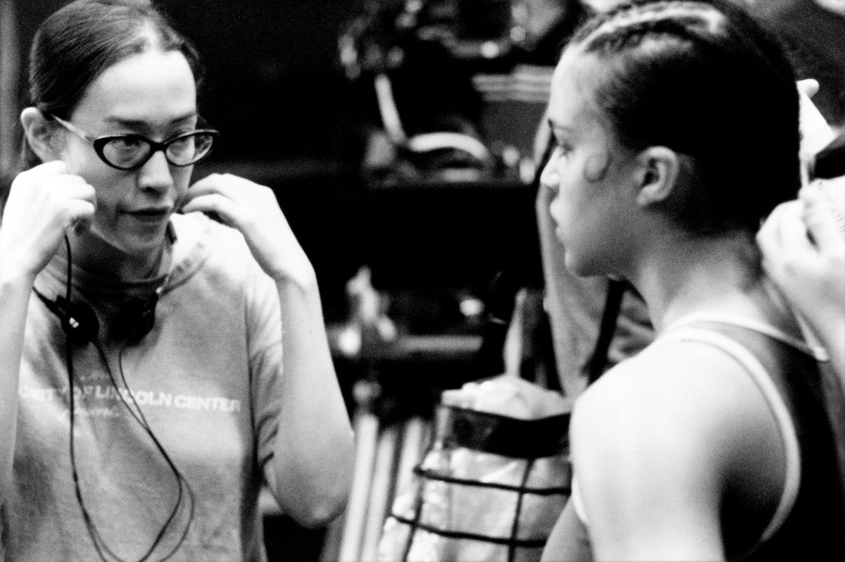A black and white image of Karyn Kusama directing Michelle Rodriguez on the set of Girlfight