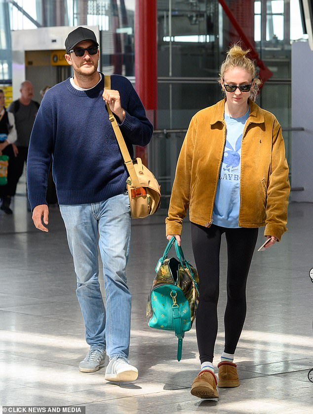 The couple appeared in good spirits as they made their way through the airport before heading off for a romantic getaway