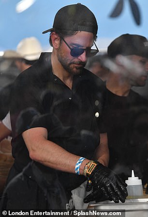 At the festival, Cooper was dressed like a chef in an all-black ensemble with an apron